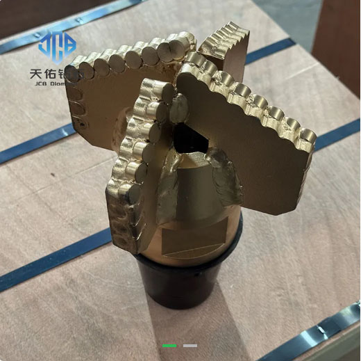 PDC drill bit for geological exploration in soft and medium‑hard formations.