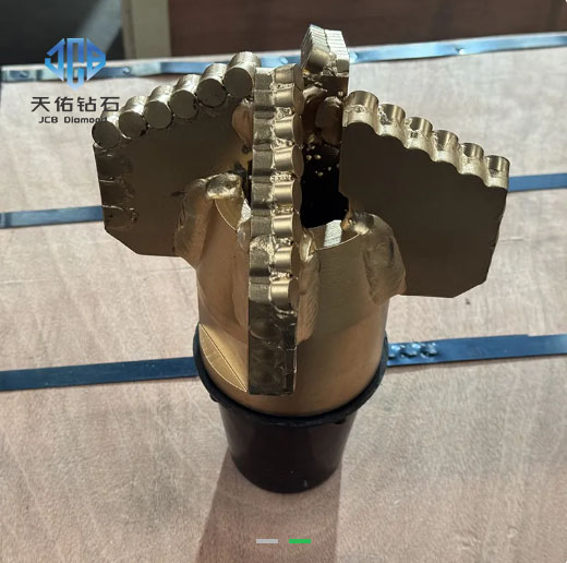 PDC drill bit for geological exploration in soft and medium‑hard formations.