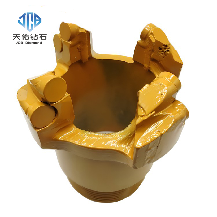 Flat crown core bit with a ribbed core for oil and gas exploration.